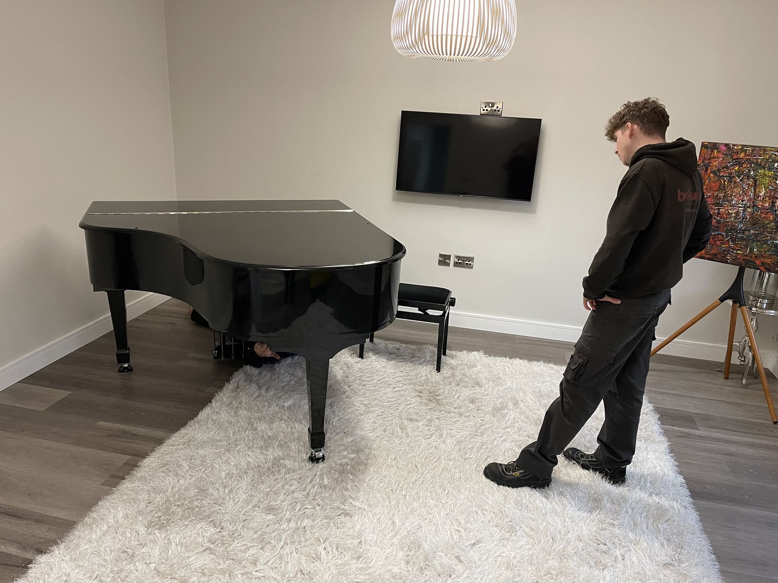 Grand piano carefully positioned by the removal team